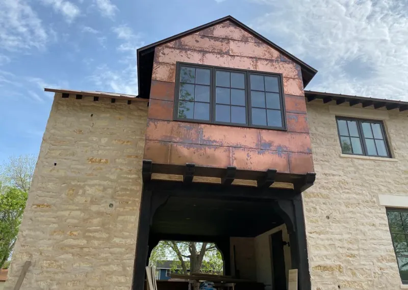 Copper metal panel facade on a stone building for Skylight Installation in Downingtown